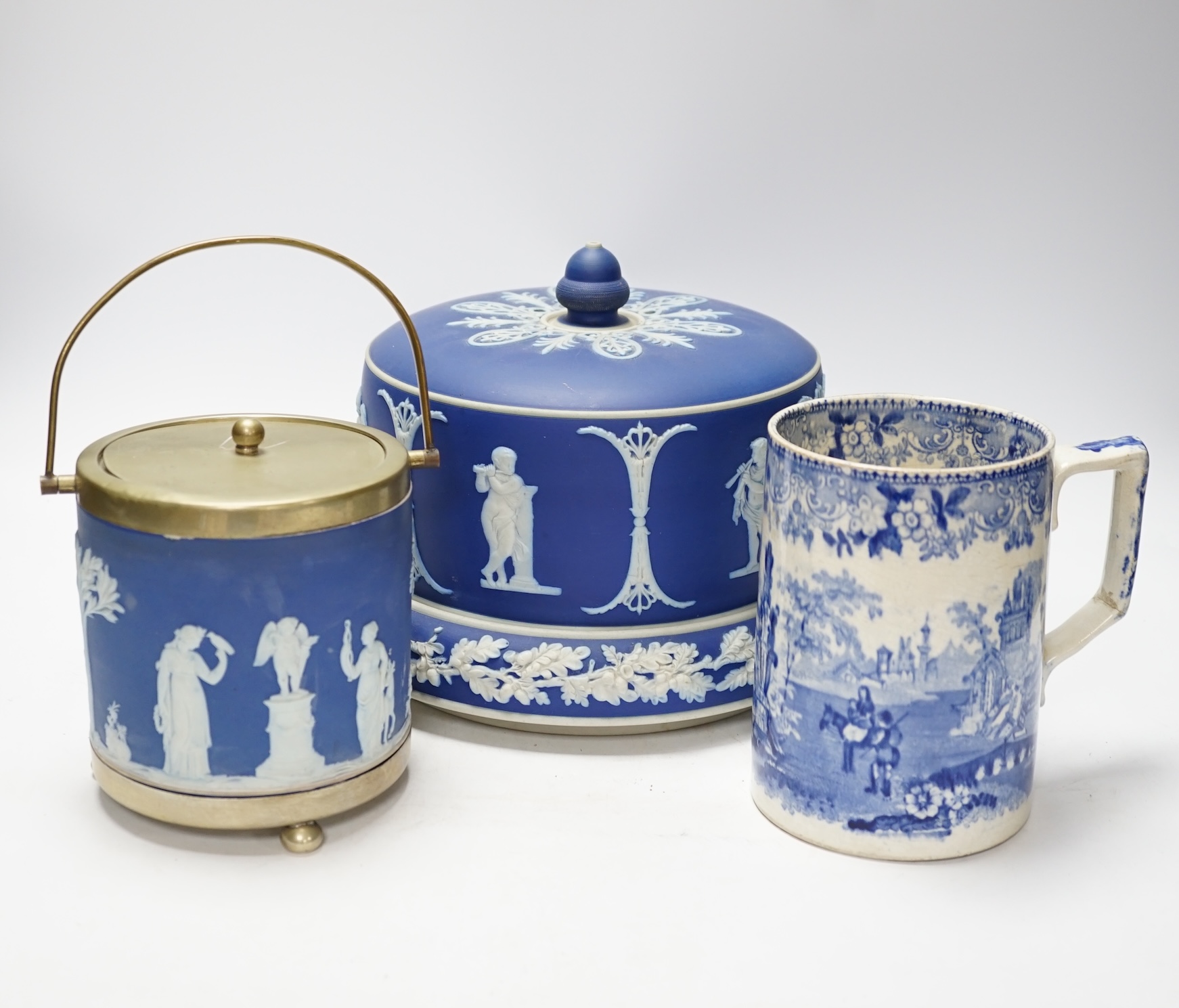 A Victorian Jasper ware cheese dome, a Wedgwood biscuit barrel and a transfer printed blue and white mug, largest 23cm in diameter